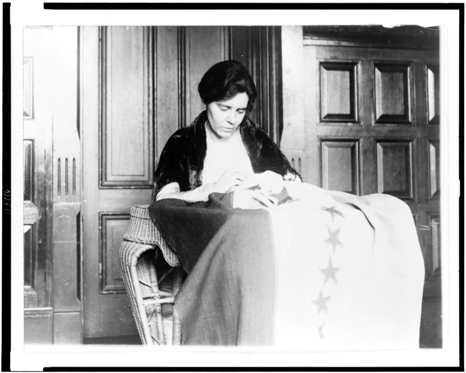 Miss Alice Pavl is shown sewing the thirty-sixth star on the suffrage ratification banner, the stars having been added from time to time as the various states ratified LCCN95507724