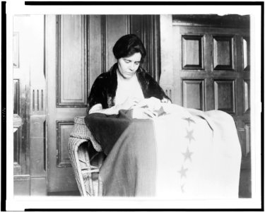 Miss Alice Pavl is shown sewing the thirty-sixth star on the suffrage ratification banner, the stars having been added from time to time as the various states ratified LCCN95507724 photo