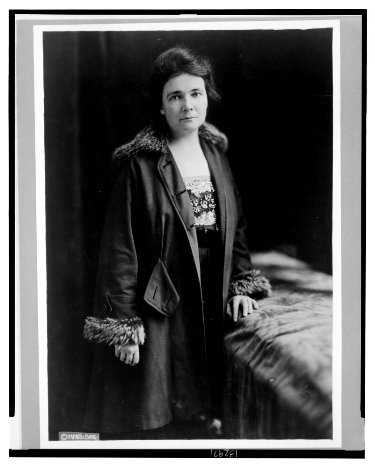 Miss Anne Martin, three-quarter length portrait, standing, facing front, wearing coat LCCN2003668347
