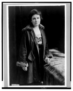 Miss Anne Martin, three-quarter length portrait, standing, facing front, wearing coat LCCN2003668347