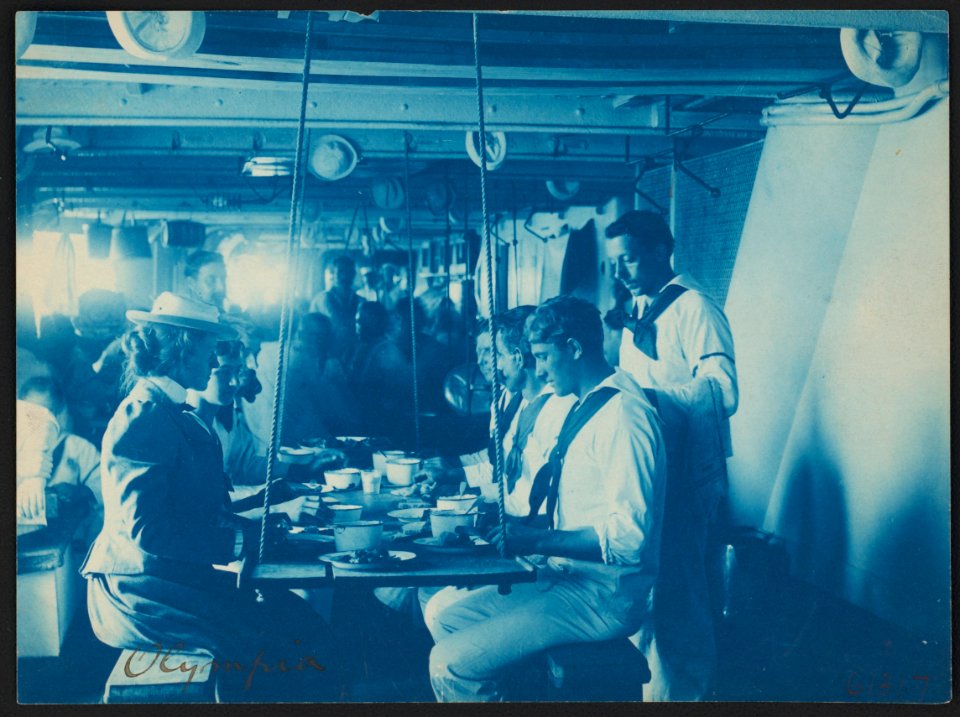 Miss Johnston having a meal with the crew on the Olympia LCCN2015647065