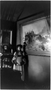 Mme. Helena Modjeska, three-quarter length portrait, standing by pictures, facing front LCCN90707062