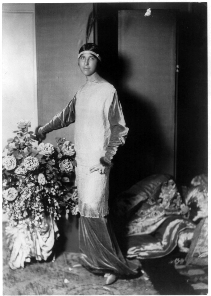Mme. Paul Poiret modelling clothing designed by her husband, 1913- American Indian fashion w- headband & feather LCCN2004682024