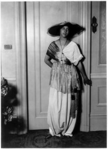 Mme. Paul Poiret modelling clothing designed by her husband, 1913- dress with tasseled sash LCCN2004682023