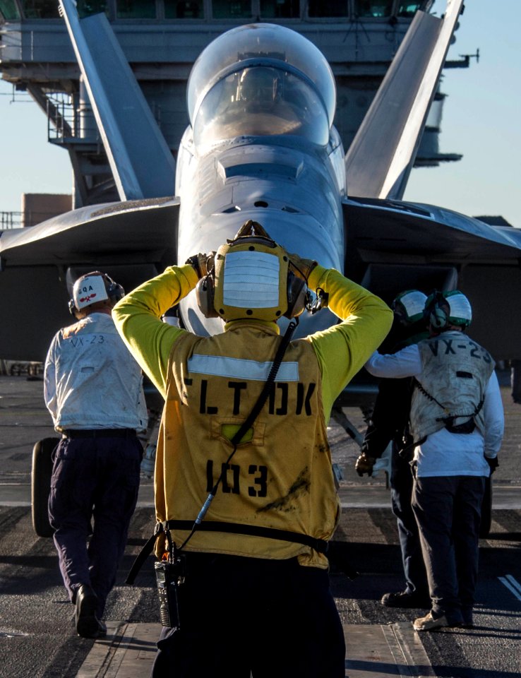 Nimitz Sailor directs Hornet onto catapult 141104-N-IP743-093