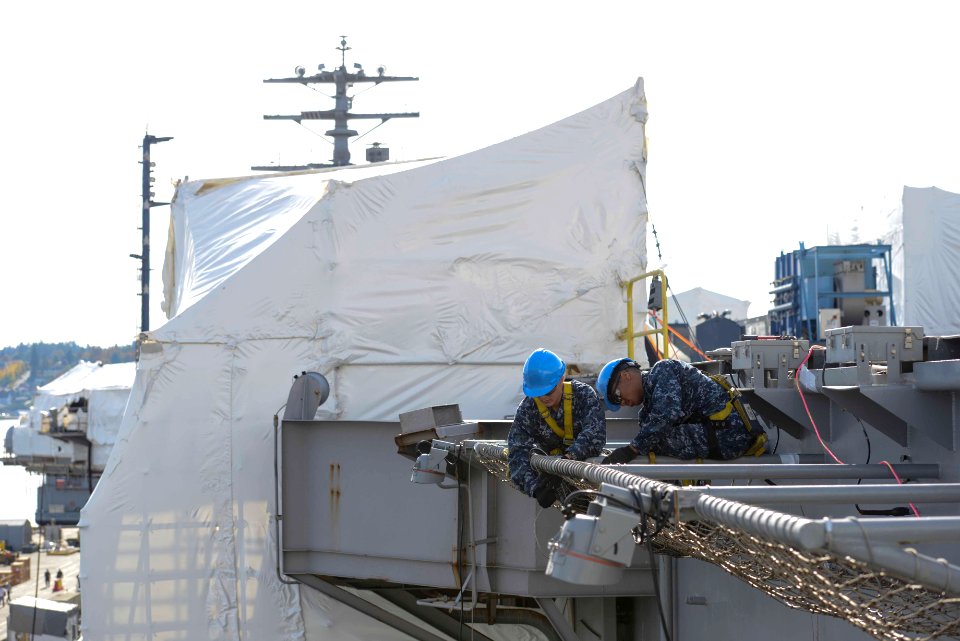 Nimitz Sailors tighten flight deck fall protection nets 150916-N-QY316-266