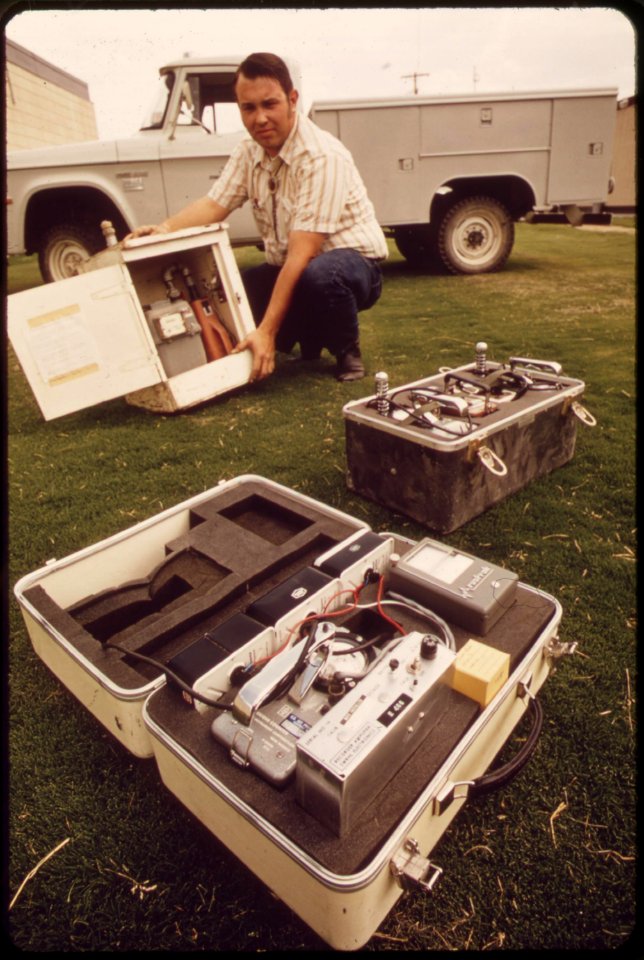 Mobile-monitoring-equipment-from-epas-las-vegas-national-research-center-technician-holds-portable-air-sampler-the-two-other-instruments-measure-radiation-may-1972 7136520515 o