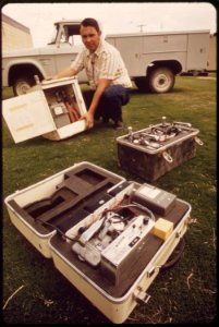 Mobile-monitoring-equipment-from-epas-las-vegas-national-research-center-technician-holds-portable-air-sampler-the-two-other-instruments-measure-radiation-may-1972 7136520515 o