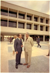Nixon standing with Lyndon Johson outside the LBJ Library in Austin , Texas. - NARA - 194358