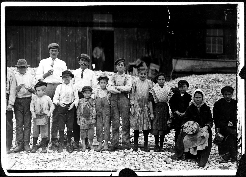 No caption. Shrimp pickers standing outside. - NARA - 523392