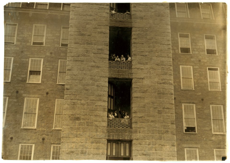 Noon hour - Merchants Mill. Girls flirting with passersby. LOC nclc.03097
