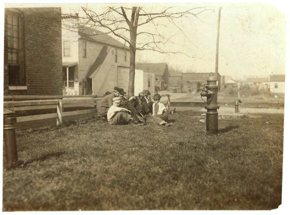 Noon hour at Brown Shoe Factory. Youngest boy is Willie McIntyre, probably under 14. Was unwilling to be photo'd and had to be taken by snapshot. LOC nclc.04721