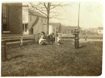 Noon hour at Brown Shoe Factory. Youngest boy is Willie McIntyre, probably under 14. Was unwilling to be photo'd and had to be taken by snapshot. LOC nclc.04721