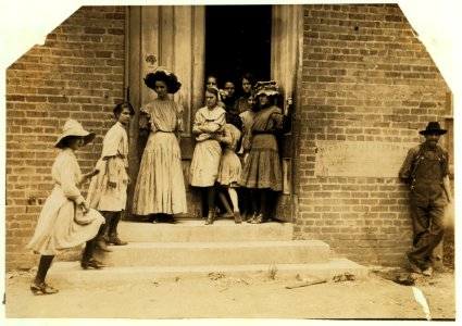 Noon hour at Delta Cotton Mills, Mc Comb, Miss. The tiny spinner pushing into the doorway tried to avoid me. LOC cph.3a18649