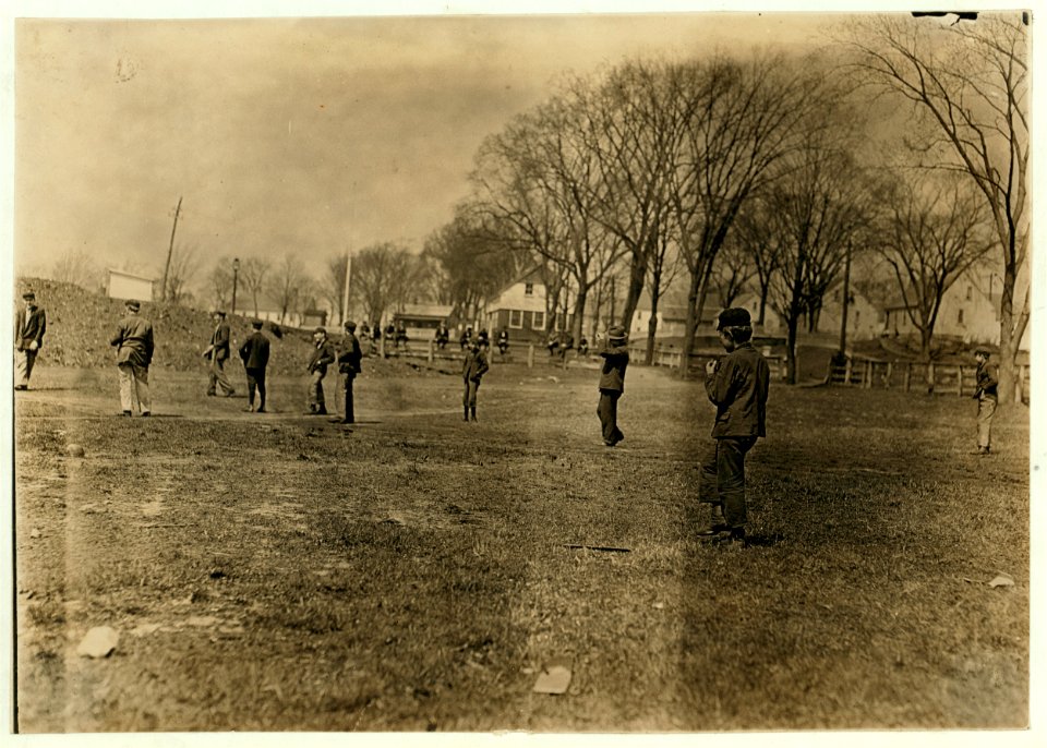 Noon hour ball-game at Quidwick Co. Hill, Anthony, R. I. All of them work in the mill. Note the boy nearest. LOC nclc.01660