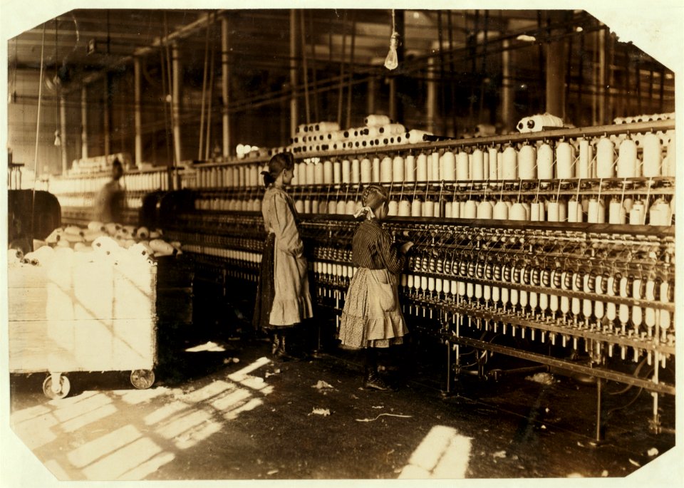 Noon hour at Newberry, (S.C.) Mill. Plenty of youngsters here. Note- In handwriting on the back of this photo it says- 'Two of the many small children I found at work at the Newberry Cotton LOC nclc.05383