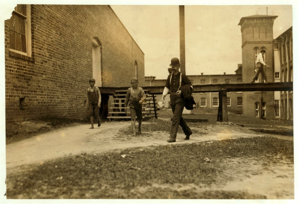 Noon hour. Two of the young doffer-boys working in the Laurel Cotton Mills, Laurel, Miss. LOC nclc.02066