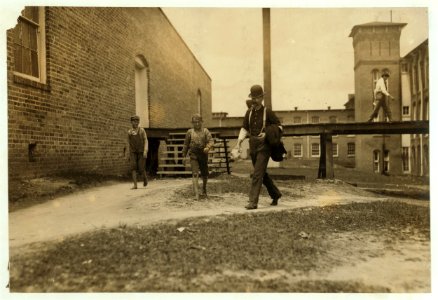 Noon hour. Two of the young doffer-boys working in the Laurel Cotton Mills, Laurel, Miss. LOC nclc.02066
