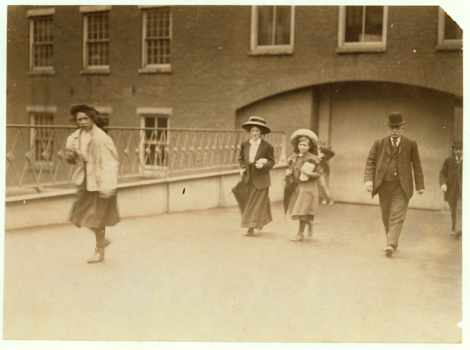 Noon, Saturday, May 22, 1909. Young girls working in Amoskeag Mills, Manchester, N.H. Many this size (and smaller) work here. LOC nclc.01748