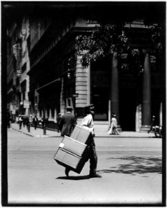 No caption. Boy delivering packages. - NARA - 523331 photo