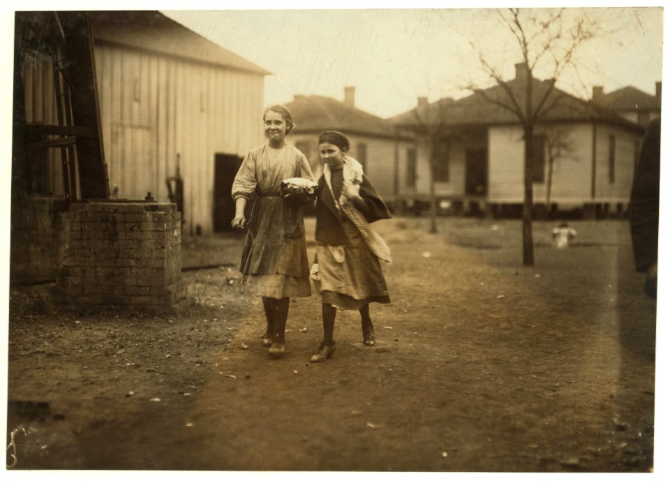 Noon hour. Going to work in Avondale Mills. I saw these girls at work inside. LOC nclc.01940