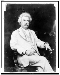 Mark Twain, three-quarter length portrait, seated, facing slightly right, with cigar in hand LCCN94511339