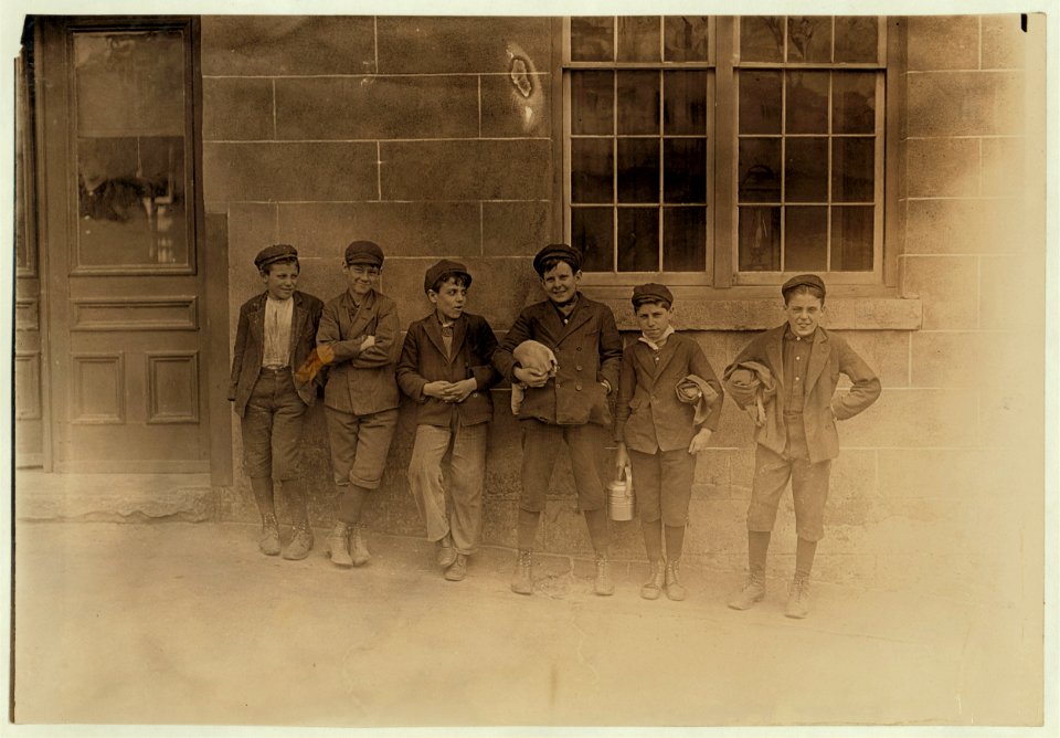 Noon hour, April 17, 1909. All these boys (and many others) work in the Natick (R.I.) Mills. Some of the smaller ones said they worked there two years. LOC nclc.01670