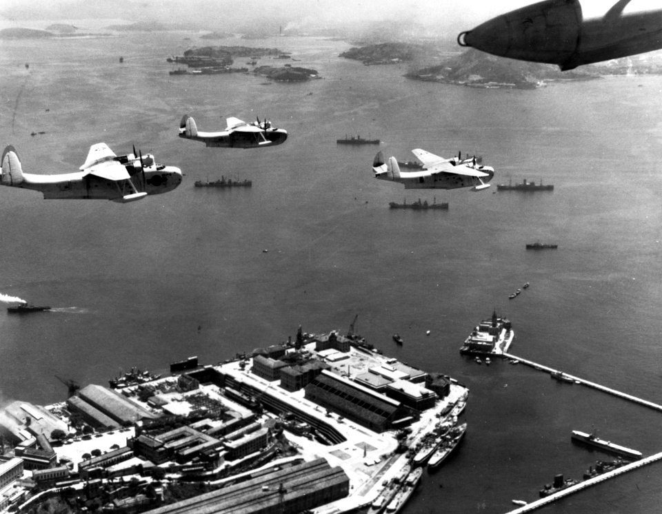 Martin PBM-3S Mariners of VPB-211 fly over Rio de Janeiro, in December 1943 (NH 94610)