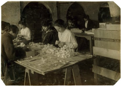 Mary Diamond, 15 years old (on right of photo) making roses at the Boston Floral Supply Co., 347-357 Cambridge Street. Said to be the only flower factory in Massachusetts. Makes 600 roses a LOC nclc.05164
