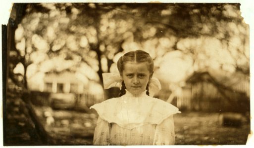 Mary Morris, nine year old oyster shucker. Shucked last year; can do four or five pots a day. Shucks every day and tends the baby. LOC nclc.00864 photo