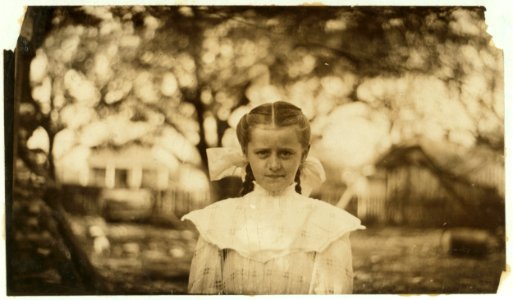 Mary Morris, nine year old oyster shucker. Shucked last year; can do four or five pots a day. Shucks every day and tends the baby. LOC nclc.00864