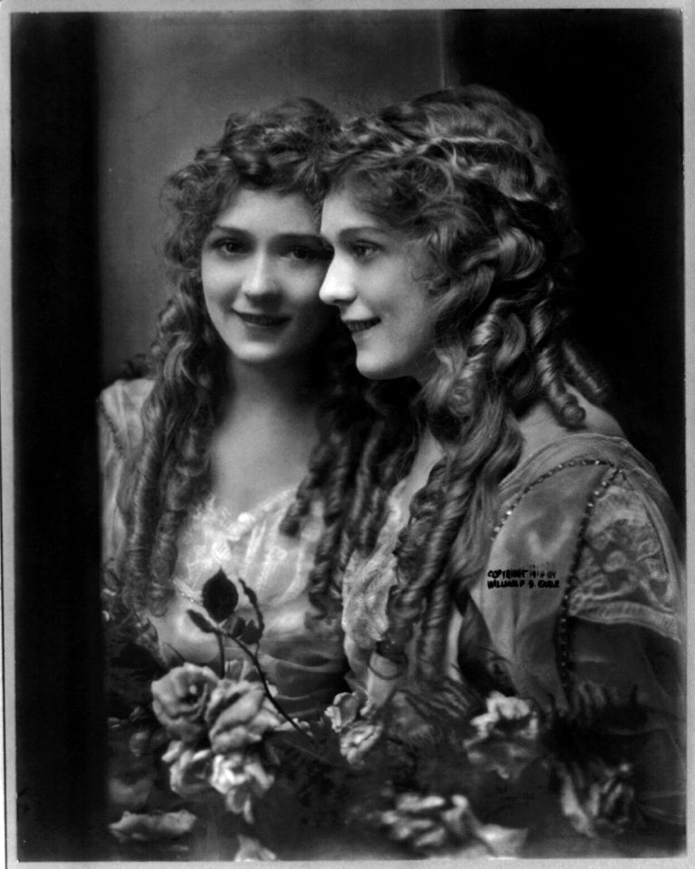 Mary Pickford, 1893-, half-length, facing left, with mirror image, facing slightly left. LCCN2005679809