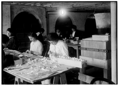Mary Donahue, 15 years old (on right of photo), curling petals at the Boston Floral Supply Co., 347-357 Cambridge Street. Said to be the only flower factory in Massachusetts. Pauline Steele, LOC nclc.05615
