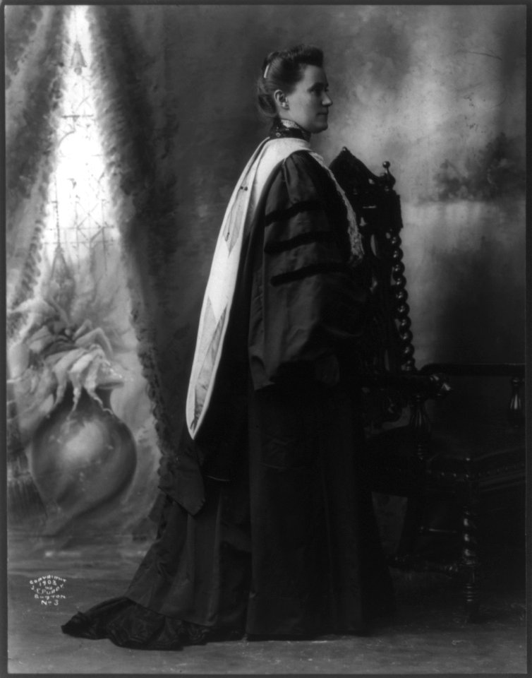 Mary Emma Wolley, 1863-1947, full length, standing by chair, facing right; in academic robes. LCCN2005686784