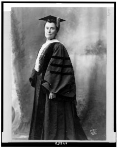 Mary Emma Woolley, three-quarter length portrait, standing, facing slightly left, wearing cap and gown LCCN94508955