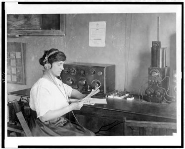 Mary Texanna Loomis, seated, with her radio apparatus in her radio school LCCN97504677 photo