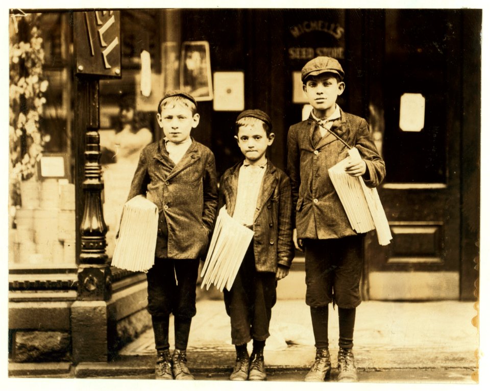Morris Goldberg (smallest boy), 316 Bainbridge St., age 7, newsboy sells from 2 P.M. to 6 P.M.; 2 P.M. to midnight on Saturday. This picture includes the 2 Mellitto (i.e., Melaten) boys. LOC cph.3c23617
