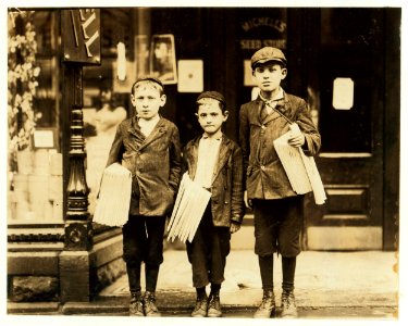 Morris Goldberg (smallest boy), 316 Bainbridge St., age 7, newsboy sells from 2 P.M. to 6 P.M.; 2 P.M. to midnight on Saturday. This picture includes the 2 Mellitto (i.e., Melaten) boys. LOC cph.3c23617