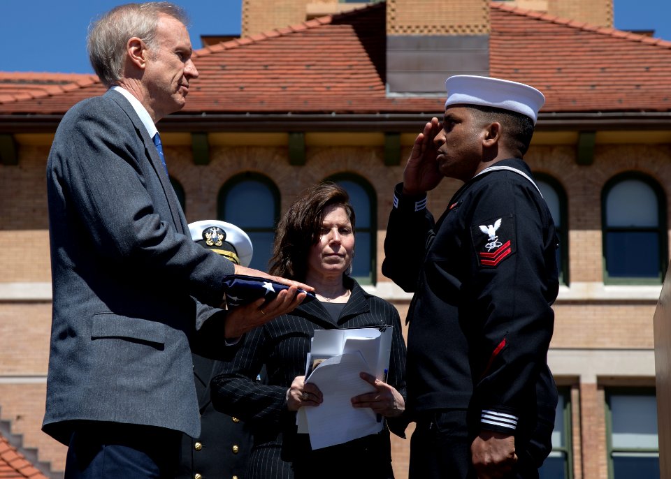 Mass Communication Specialist 2nd Class Danian Douglas presents Illinois Gov. Bruce Rauner with a flag flown over Abraham Lincoln's grave. (17025352778)