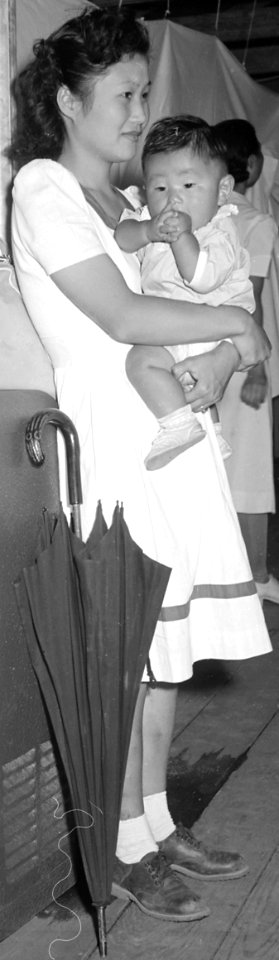 Mother and child in Manzanar Relocation Center, Manzanar, California. A typical interior scene in one of the barrack ap . . . - NARA - 538136 (cropped)
