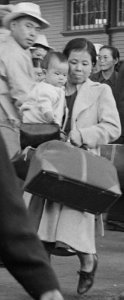 Mother and child detail, Woodland, California. Families of Japanese ancestry leave the station platform to board the train f . . . - NARA - 537810 (cropped) photo