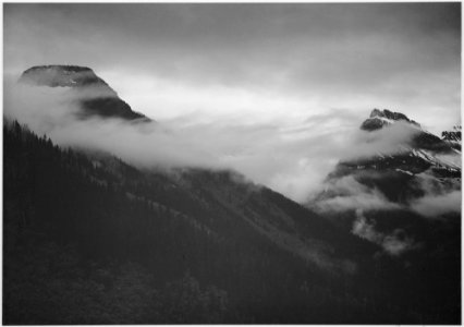 Mountain partially covered with clouds, In Glacier National Park, Montana., 1933 - 1942 - NARA - 519860 photo