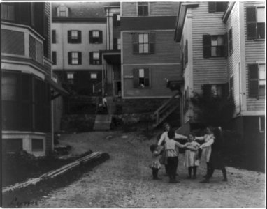 Massachusetts. Lynn. Shoe industry- children playing ring around the rosie in workers residential area. LCCN2016650772