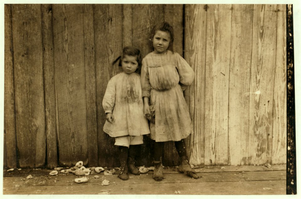 Maud Daly, five years old. Grace Daly, three years old. Pick shrimp at the Peerless Oyster Co. Their mother said they both help, and their sister said the little one worked the fastest. Many LOC nclc.00894