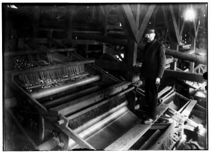 Mr. A. Langerfeld and one of his machines for picking coal which does away completely with the use of breaker boys. The percent of slate that goes in with the coal separated by this machine LOC nclc.05511