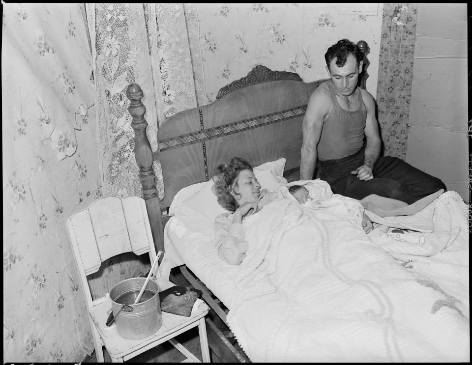 Mr. and Mrs. Andrew Broughton with their twelve hour old baby. They and their other son live in a four room house for... - NARA - 541152