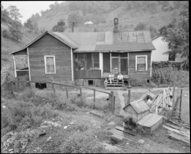 Mr. and Mrs. James Wheeler and their children and home in company housing project. Raven Red Ash Coal Company, No. 2... - NARA - 541114