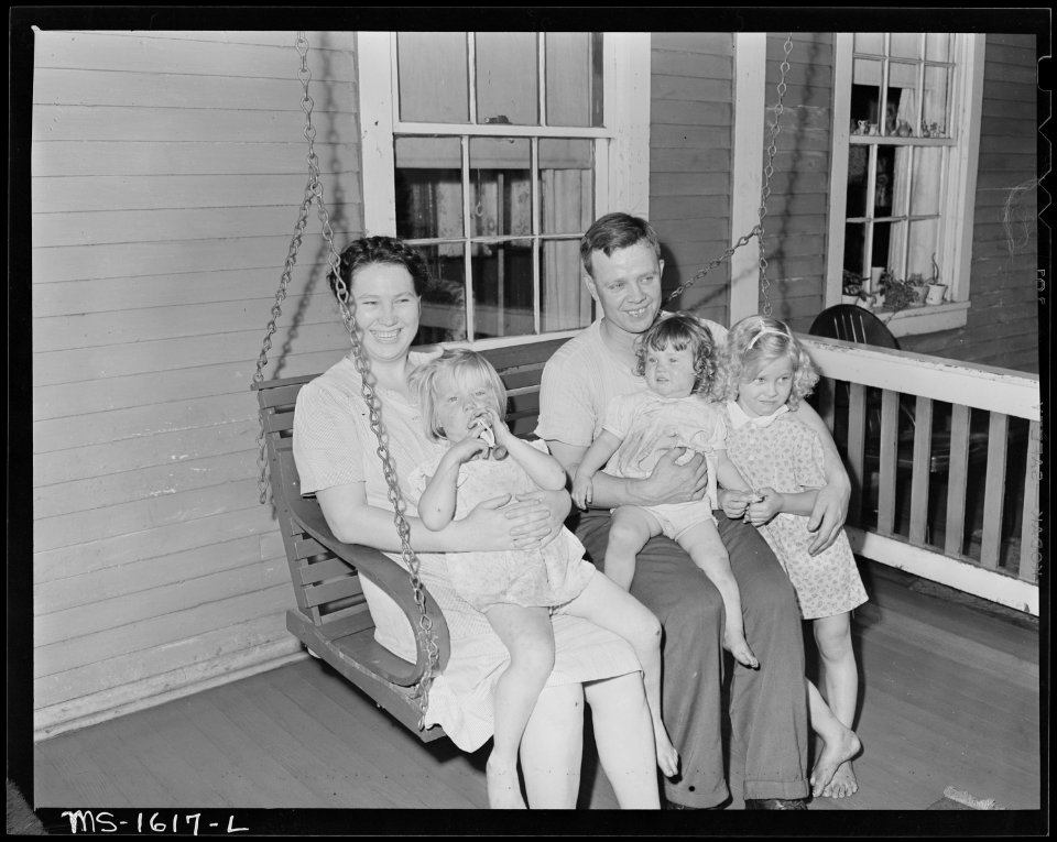 Mr. and Mrs. E. R. Kunz and their three daughters on the front porch of their house. U.S. Coal and Coke Company, Gary... - NARA - 540881