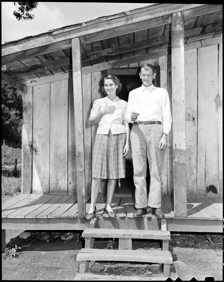 Mr. and Mrs. Oscar Powers on the front porch of their house. Big Jim Coal Corporation, Big Jim Mine, Blanche, Bell... - NARA - 541166
