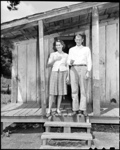Mr. and Mrs. Oscar Powers on the front porch of their house. Big Jim Coal Corporation, Big Jim Mine, Blanche, Bell... - NARA - 541166